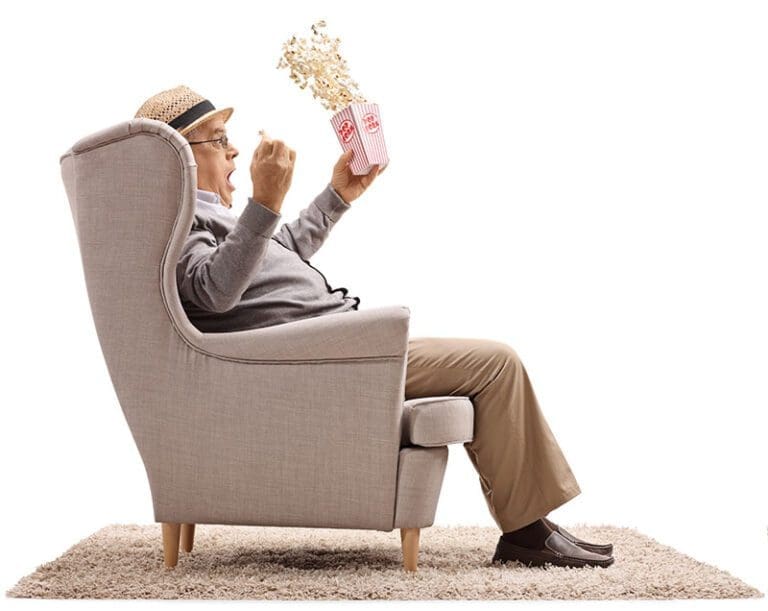 Senior in chair watching TV