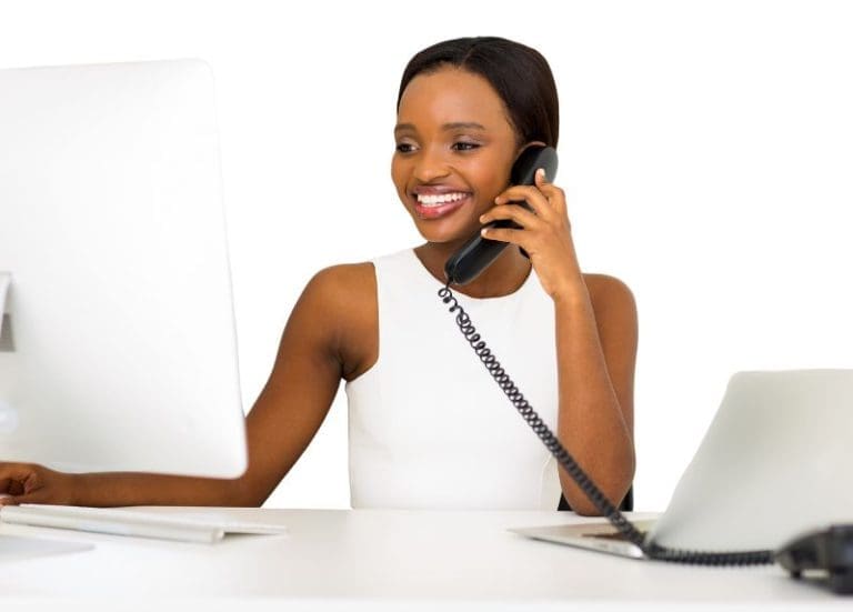 Professional Woman Talking on Landline Phone