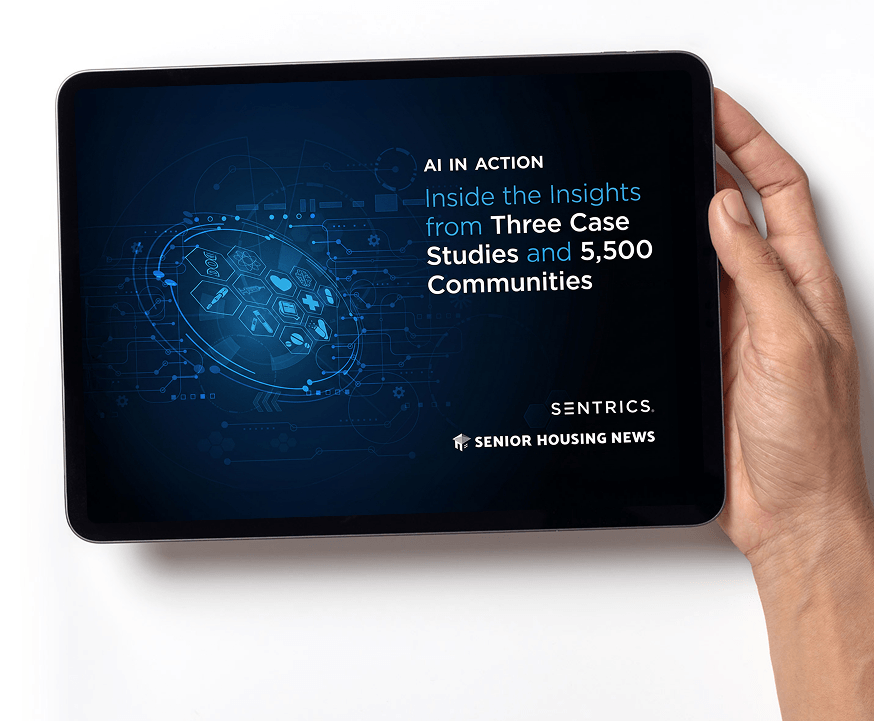 Person holding a tablet showing AI insights from case studies and senior housing communities on screen.