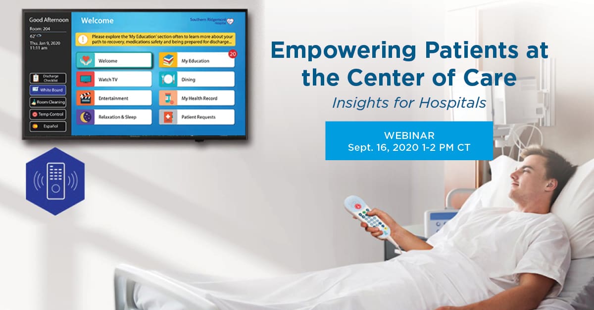 Person in hospital bed using a remote control to navigate a patient information screen on a monitor.