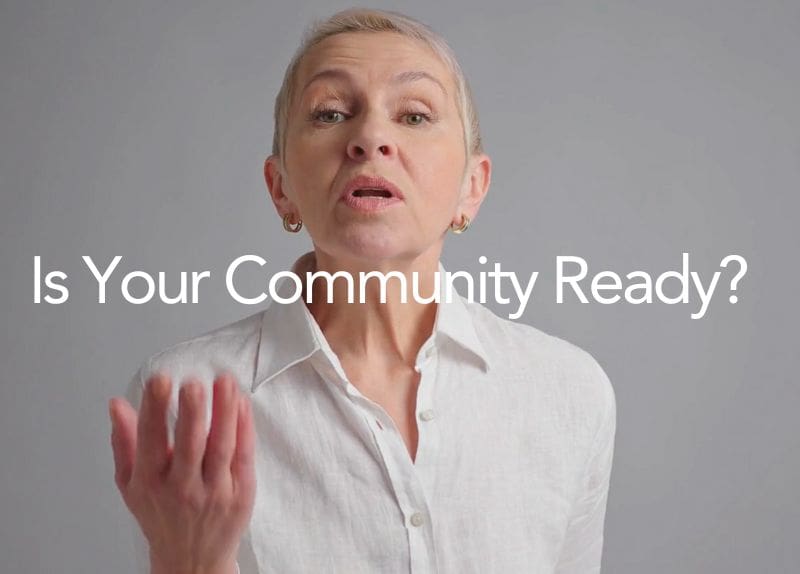 Person speaking and gesturing with text overlay asking if the community is ready.