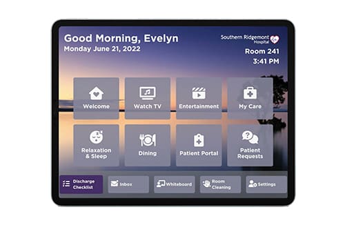 Digital touchscreen interface showing personalized care, entertainment, and dining options for a resident with a lake background.